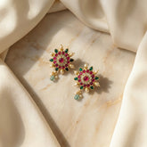 Jadau kundan floral studs with pearl and natural strawberry beads