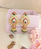 Jadau kundan bridal peacock jhumkas with pearl and natural strawberry beads