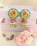 Jadau kundan peacock jhumkas with pearl and natural strawberry beads drop