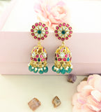 Jadau kundan peacock jhumkas with pearl and natural strawberry beads drop