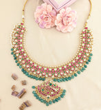 Jadau kundan peacock necklace with pearl and natural strawberry beads drop