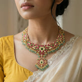 Jadau kundan peacock necklace with pearl and natural strawberry beads(without earrings)