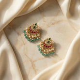 Jadau kundan studs with pearl and natural strawberry beads