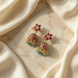 Jadau kundan floral jhumkas with pearl and natural strawberry beads drops
