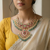 Jadau kundan necklace with pearl and natural strawberry beads drop