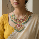 Jadau kundan necklace with pearl and natural strawberry beads drop