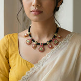 Jadau kundan black thread bottu and mango necklace
