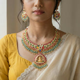 Jadau kundan Navratna goddess laxmi necklace set with earrings with pearl and natural strawberry beads drop