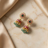 jadau kundan jhumkas with pearl and natural strawberry beads drop