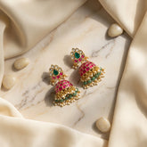 Jadau kundan jhumkas with pearl and natural strawberry beads drop