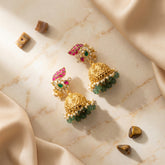 Jadau Kundan+antique polish peacock jhumkas with pearl and natural strawberry beads drop