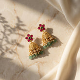 Jadau kundan+Antique jhumkas with pearl and natural strawberry beads drop