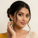 Jadau kundan peacock jhumkas with pearl and natural strawberry beads drop