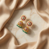 Jadau kundan floral jhumkas with pearl and natural strawberry beads drop