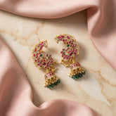 Jadau kundan peacock jhumkas with pearl and natural strawberry beads drop