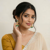 Jadau kundan jhumkas with pearl and natural strawberry beads drop