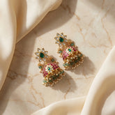 Jadau kundan jhumkas with pearl and natural strawberry beads