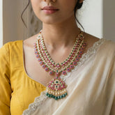 Jadau kundan 2 line peacock long necklace with pearl and natural strawberry beads drop