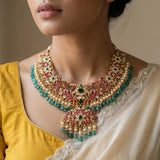 Jadau kundan peacock necklace with pearl and natural strawberry beads