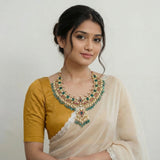 Jadau kundan necklace with carving stone, pearl and natural strawberry beads
