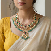 Jadau kundan necklace with carving stone, pearl and natural strawberry beads