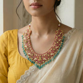 Jadau kundan goddess laxmi necklace with pearl and natural strawberry beads drop(No Earrings)