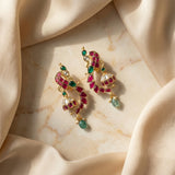 Jadau kundan peacock jhumkas with pearl and natural strawberry beads