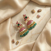 Jadau kundan peacock jhumkas with pearl and natural strawberry beads