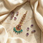 Jadau kundan floral tika with pearl and natural strawberry beads drop
