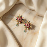 Jadau kundan floral studs with pearl and natural strawberry beads