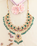Jadau kundan necklace with carving stone, pearl and natural strawberry beads