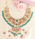 Jadau kundan peacock necklace with pearl and natural strawberry beads