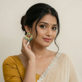 Jadau kundan studs with pearl and natural strawberry beads