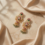 Jadau kundan bridal peacock jhumkas with pearl and natural strawberry beads