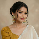 Jadau kundan peacock jhumkas with pearl and natural strawberry beads drop