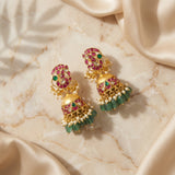 Jadau kundan peacock jhumkas with pearl and natural strawberry beads drop