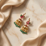 Jadau kundan peacock jhumkas with pearl and natural strawberry beads