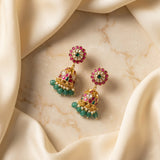 Jadau kundan peacock jhumkas with pearl and natural strawberry beads drop