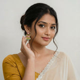 Jadau kundan floral jhumkas with pearl and natural strawberry beads drop