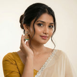 Jadau kundan floral jhumkas with pearl and natural strawberry beads drop