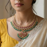 Jadau kundan peacock necklace with pearl and natural strawberry beads drop