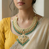 Jadau kundan leaf necklace with pearl and natural strawberry beads drop(No Earrings)